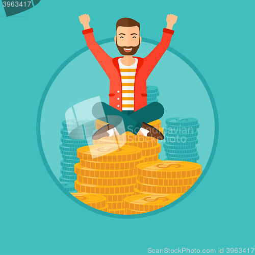 Image of  Happy businessman sitting on coins.