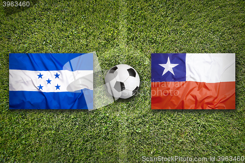 Image of Honduras vs. Chile flags on soccer field