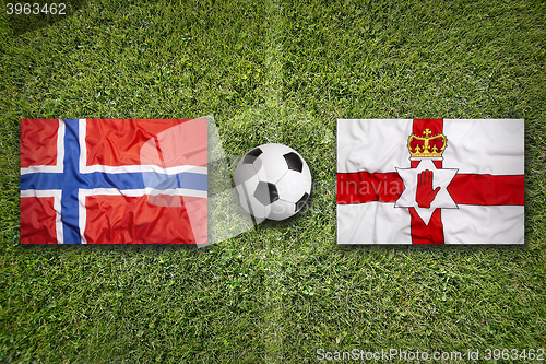 Image of Norway vs. Northern Ireland flags on soccer field