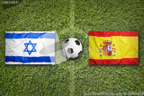 Image of Israel vs. Spain flags on soccer field