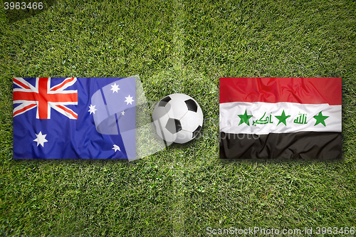 Image of Australia vs. Iraq flags on soccer field