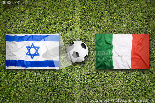 Image of Israel vs. Italy flags on soccer field