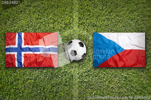 Image of Norway vs. Czech Republic flags on soccer field