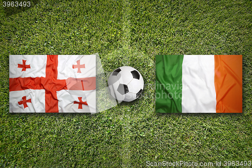 Image of Georgia vs. Ireland flags on soccer field