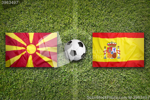 Image of Macedonia vs. Spain flags on soccer field