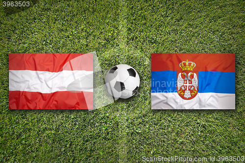 Image of Austria vs. Serbia flags on soccer field