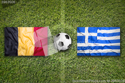 Image of Belgium vs. Greece flags on soccer field