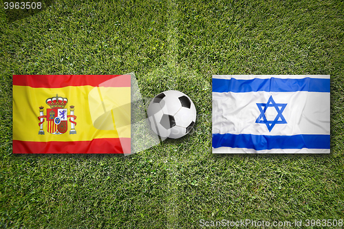 Image of Spain vs. Israel flags on soccer field