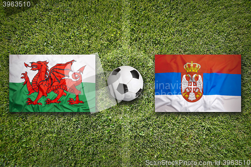 Image of Wales vs. Serbia flags on soccer field