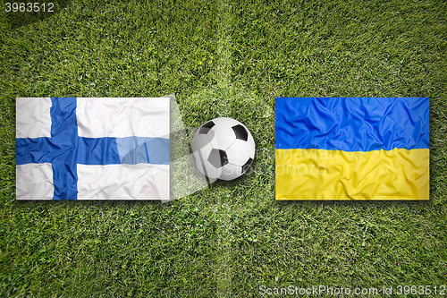 Image of Finland vs. Ukraine flags on soccer field