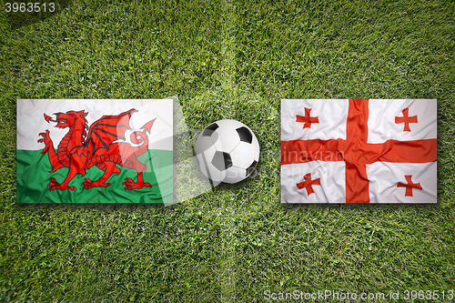 Image of Wales vs. Georgia flags on soccer field