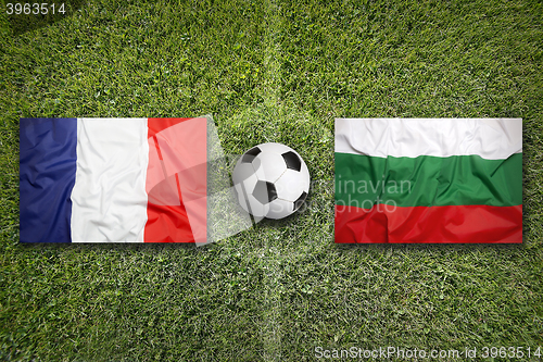 Image of France vs. Bulgaria flags on soccer field