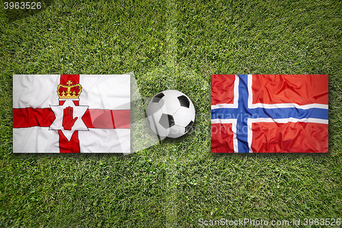 Image of Northern Ireland vs. Norway flags on soccer field