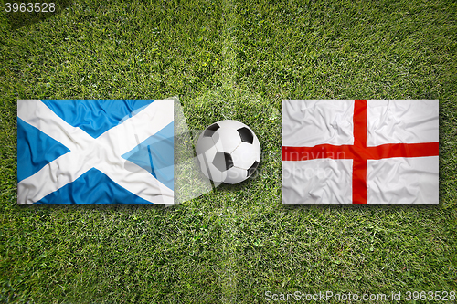 Image of Scotland vs. England flags on soccer field