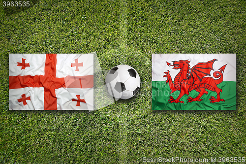 Image of Georgia vs. Wales flags on soccer field