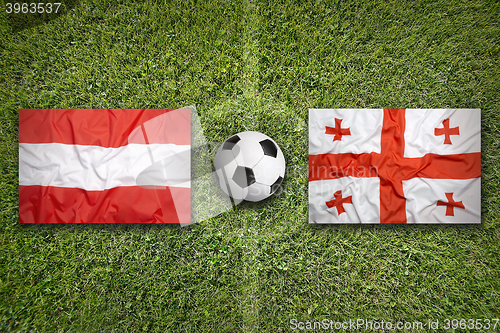 Image of Austria vs. Georgia flags on soccer field