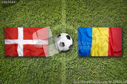 Image of Denmark vs. Romania flags on soccer field
