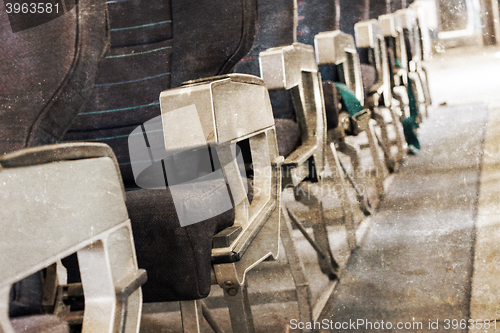 Image of Empty old airplane seats in the cabin, selective focus, vintage 