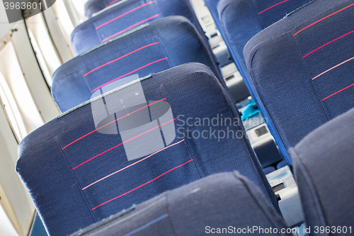 Image of Empty old airplane seats in the cabin, selective focus