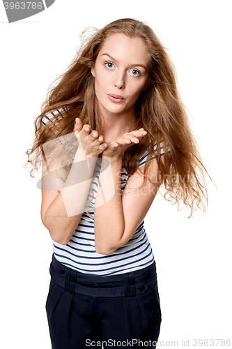 Image of Woman blowing a kiss at camera