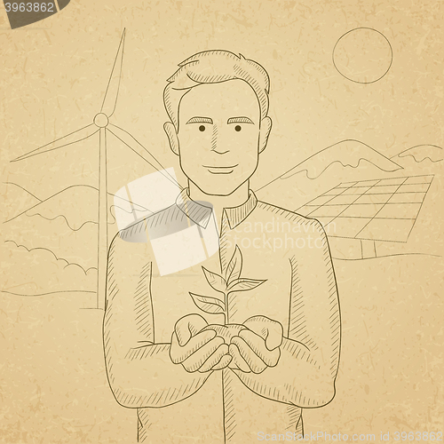 Image of Man holding plant.