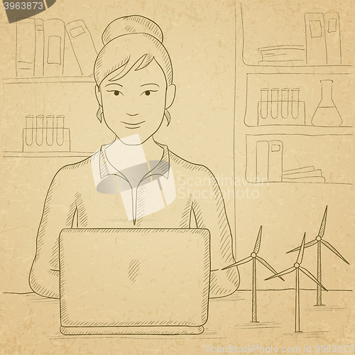 Image of Woman working at laptop. 