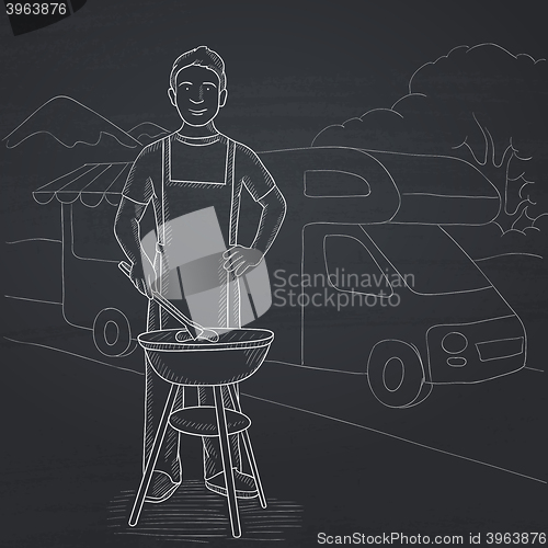 Image of Man preparing barbecue.