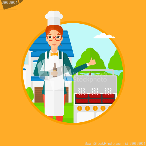 Image of Woman cooking meat on grill.