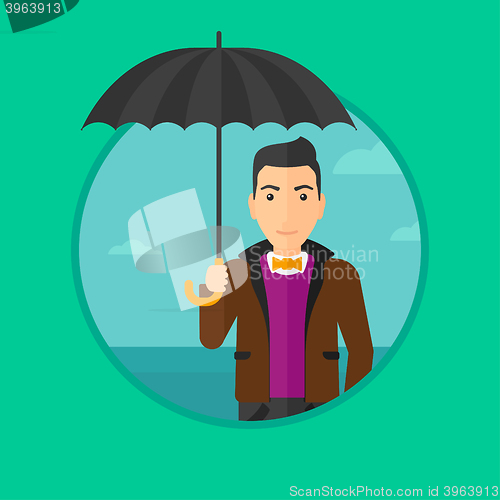 Image of Business man with umbrella.