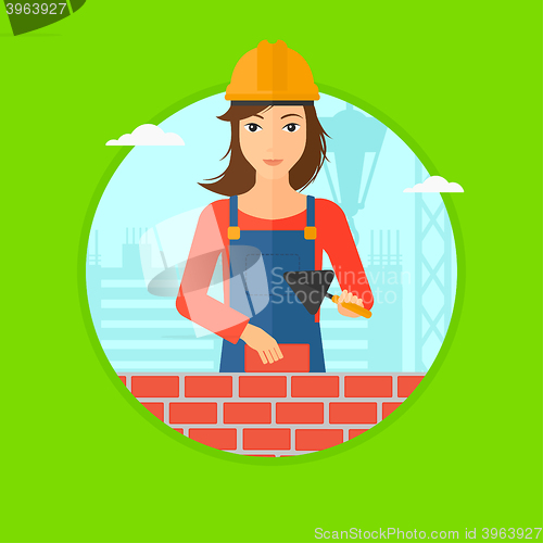 Image of Bricklayer with spatula and brick.