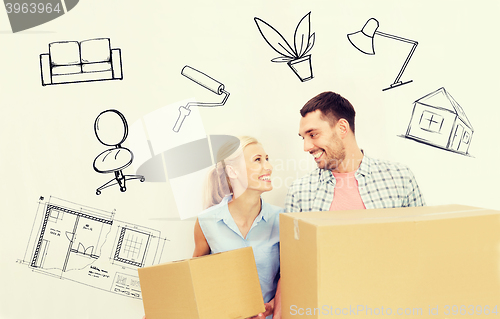 Image of couple with delivery boxes moving to new home