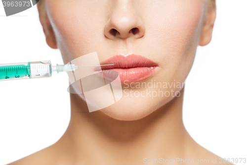 Image of woman face and syringe making injection