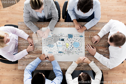 Image of business team with scheme meeting at office