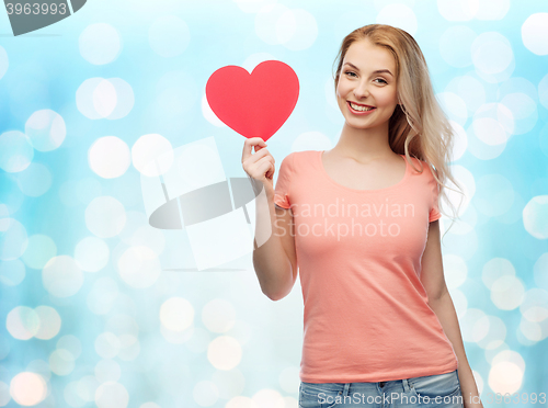 Image of happy woman or teen girl with red heart shape