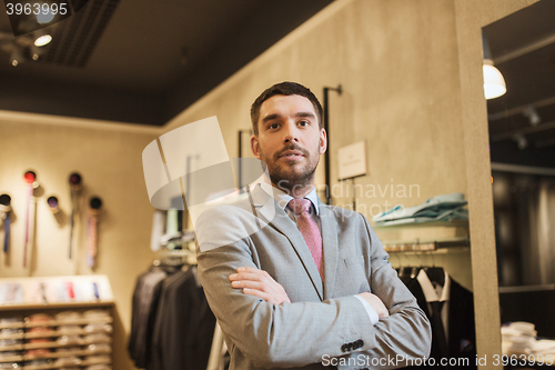 Image of young man or businessman in suit at clothing store