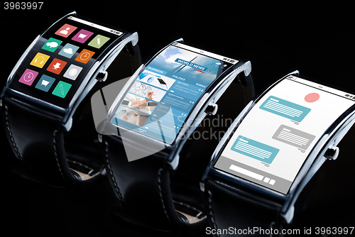 Image of close up of black smart watch set with multimedia