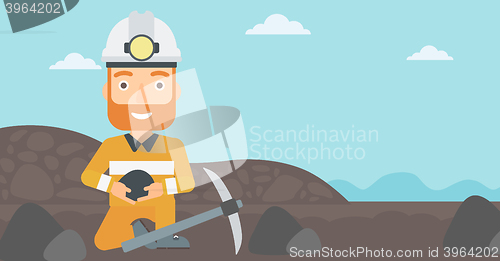 Image of Miner holding coal in hands.