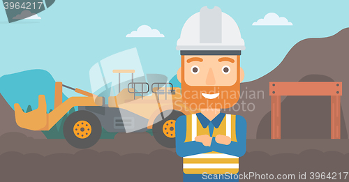 Image of Miner with mining equipment on background.