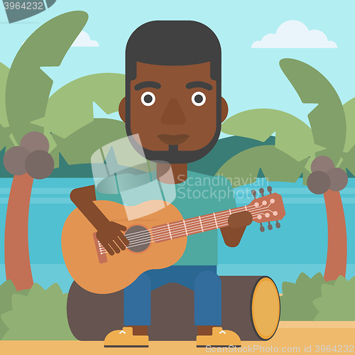 Image of Man playing guitar.