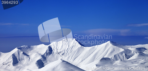 Image of Panoramic view on snow mountains and blue sky