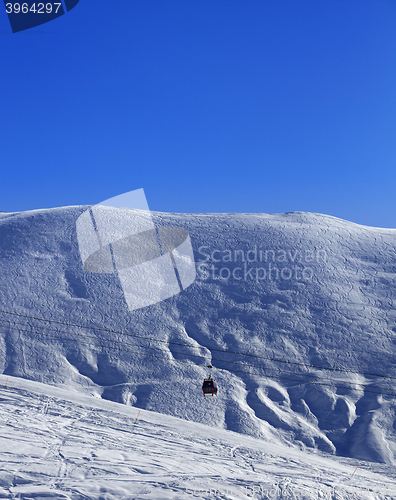 Image of Gondola lift and off-piste slope