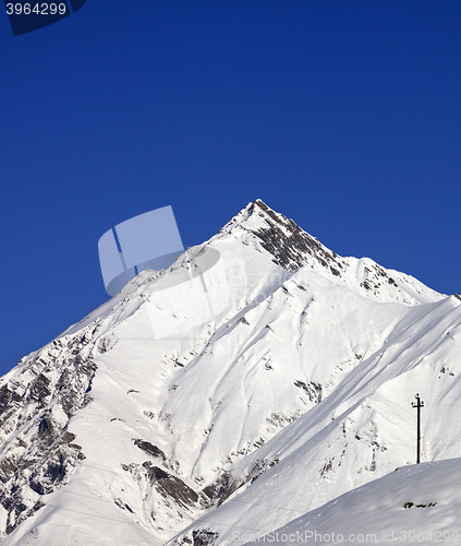 Image of Snowy mountains and blue clear sky in nice day