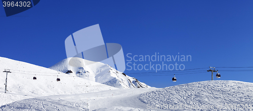 Image of Panoramic view on gondola lift and ski slope at nice day