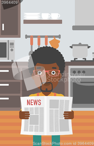 Image of Man reading newspaper.