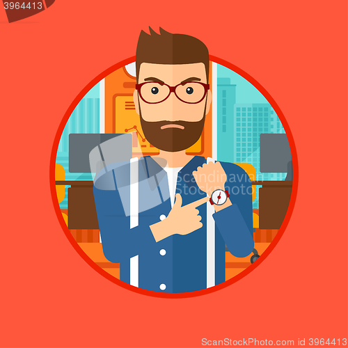 Image of Angry boss pointing at wrist watch.