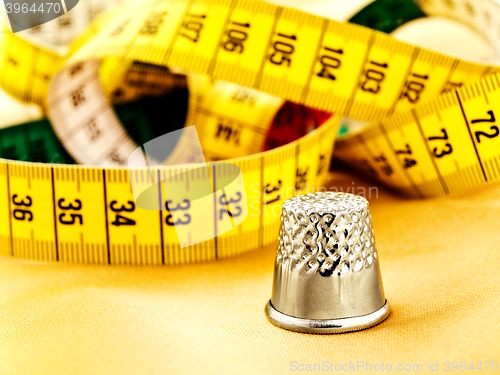 Image of Measuring Tape And Thimble