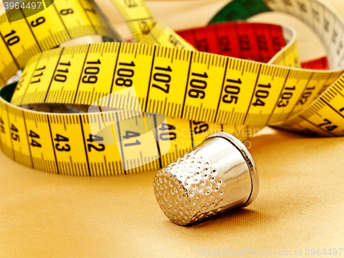 Image of Measuring Tape And Thimble