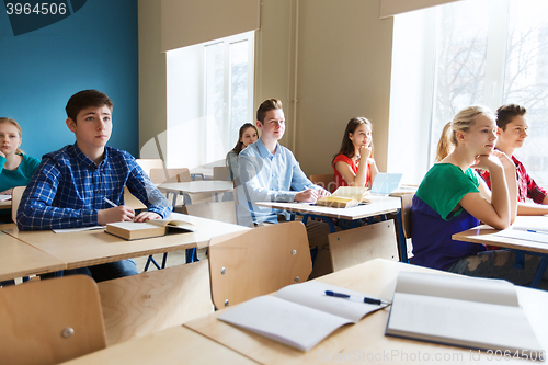 Image of group of students with books at school lesson