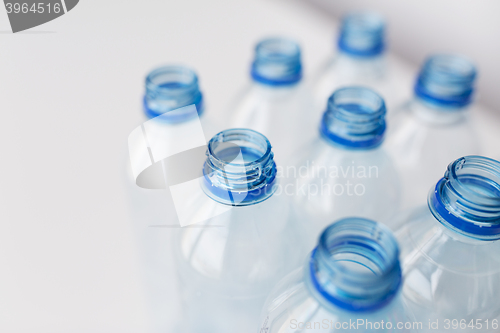 Image of close up of empty used plastic bottles on table