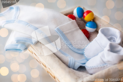 Image of close up of baby clothes for newborn boy in basket